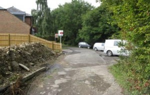 The development site is on the left. The converted pub is further along on the left, with its hardstanding possibly encroaching on the bridleway. Booker Common is to the left.