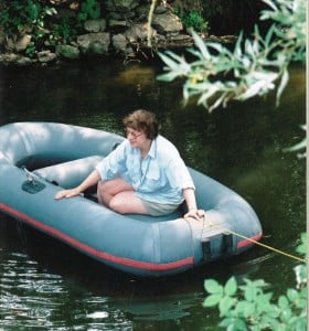 The late Yvonne Crawley crosses the Thame at the site of the stepping stones during a Ramblers’ 2003 demo; her husband Hugh researched and made the claim to have the crossing recognised as a right of way. The footings of the former weir-bridge can be seen behind her. Photo Chris Hall. 