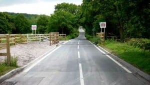 The fencing runs beneath the road to avoid the need for a cattle-grid