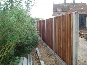 Before: The wooden fence has stolen much of the width of the path