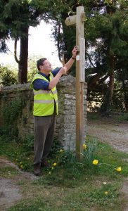 Peter completing a signpost