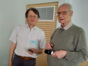 Chris Beney (left) presents John Lavery with a gift in appreciation of his time as a trustee.