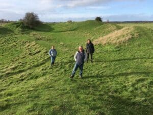 Dyke Hills with the landowner, Keith Ives (centre). Louise Aukland (left) and Becky Waller (right) submitted an application for this to be registered as a village green